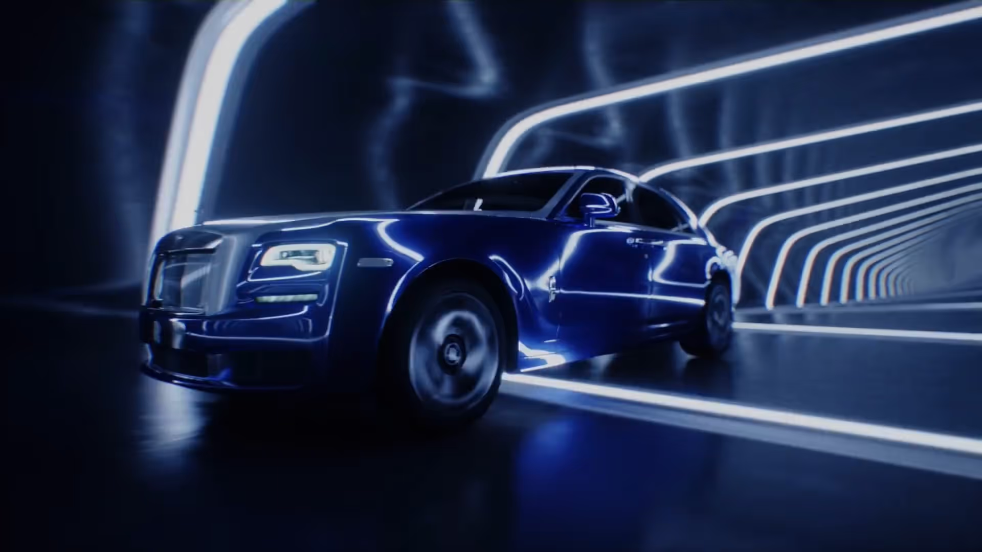 Rolls Royce I am Ghost campaigm still, blue car driving through a neon tunnel